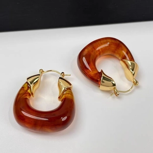 Amber geometric resin C-hoop earrings with gold-plated metal accents for women