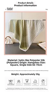 Detail view of 70cm silk-satin square scarf with green geometric print and size info