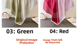 Detail of elegant silk scarves in green and red with geometric chain patterns