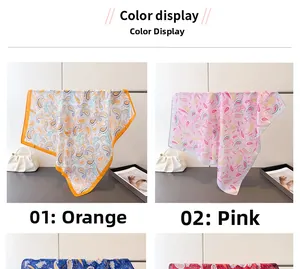 Close-up of orange and pink paisley silk scarves showing glossy texture and pattern