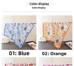 Detailed view of tropical palm and toucan prints on blue and orange silk scarves