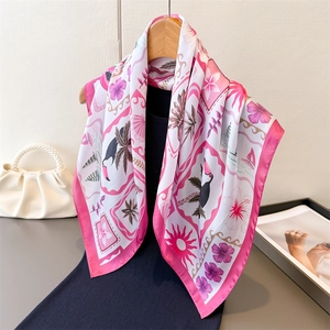 Tropical print satin square scarf with toucan and hibiscus pattern on wooden hanger