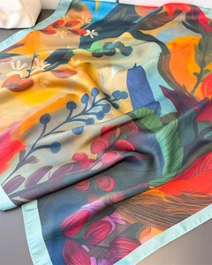 Detailed view of sunflower oil painting print silk scarf with light blue hemmed edges
