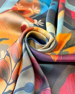 Macro detail of sunflower oil painting print silk scarf showing soft folds and lustrous texture