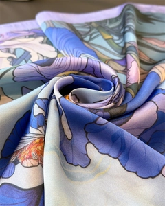Close-up of silk-like scarf featuring oil painting purple iris floral prints and texture