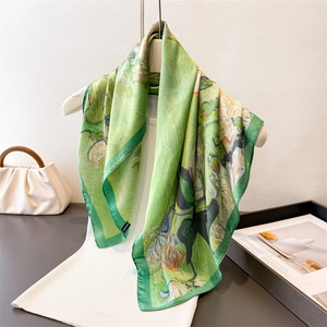 Artistic oil painting style silk scarf with green floral print hanging elegantly