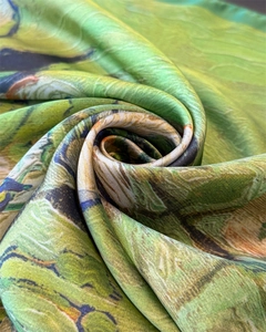 Close-up of silk scarf with artistic oil painting print in spiral floral styling