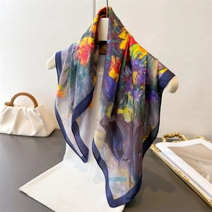 Artistic oil painting style silk scarf with vibrant floral patterns on a white garment