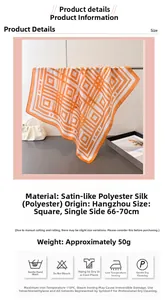 Detail view of the geometric pattern silk-like scarf with washing care instructions