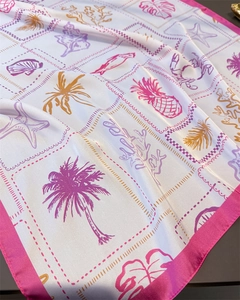 Detailed view of satin scarf with tropical palm, shell prints and pink border