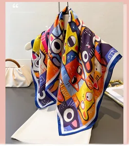 Detailed close-up of colorful cat illustration print on glossy silk scarf with blue edges