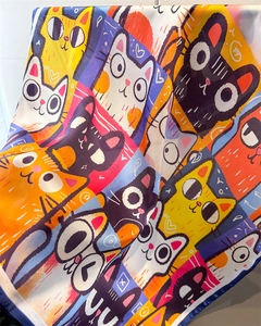Detailed view of pop art cat print on satin scarf showing silky texture and vibrant colors