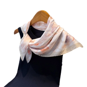 Elegant tulip print faux silk scarf tied as a bow on a black top for women
