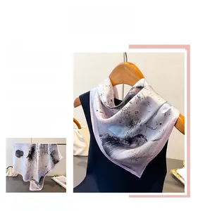 Detail of artistic ink wash print silk scarf with purple rolled edges and subtle sheen