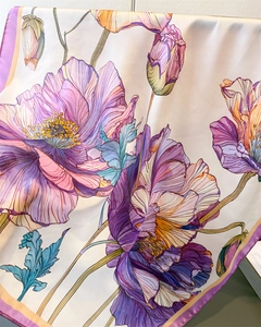 Close-up of floral print silk scarf with purple poppies and satin texture detail