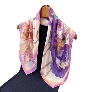 Elegant floral print silk-like scarf featuring purple and orange artistic blooms