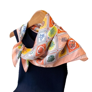 Tropical sea shell and palm leaf printed satin silk scarf in vibrant orange and yellow