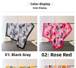 Detail view of printed faux silk scarves in black-grey camouflage and bright rose patterns