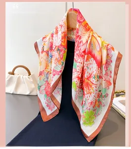 Detailed texture of silk scarf with floral lily pattern on a wooden hanger background