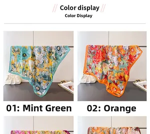 Detailed view of mint green and orange floral silk scarves with elegant blooming patterns