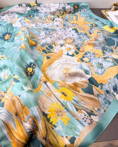 Detailed macro shot of vintage floral silk scarf with elegant mint and yellow oil painting texture