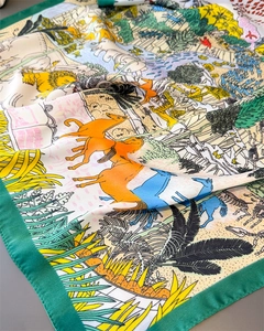 Detailed view of the soft satin scarf featuring vibrant jungle animals and floral patterns