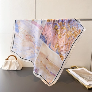 Floral oil painting silk square scarf with iris and coastal scenery on a metal rack