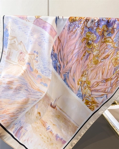 Close-up of floral oil painting silk scarf with elegant iris patterns and rolled edges