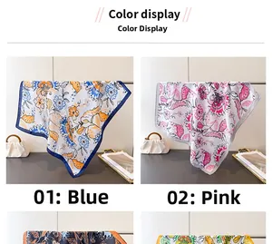 Close-up of vintage floral printed silk scarves featuring delicate hemmed edges and smooth texture