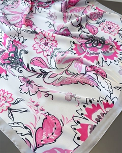 Detailed view of floral silk-feel square scarf with pink blooms and grey border