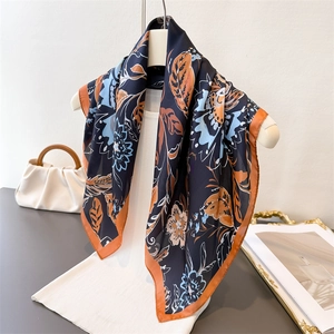 Floral print vintage silk square scarf in navy blue with elegant orange floral patterns