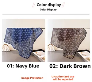 Detail view of navy and dark brown silk square scarves with elegant paisley pattern print