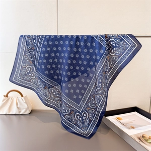 Navy blue silk-like square scarf with white paisley pattern and heart-shaped accents