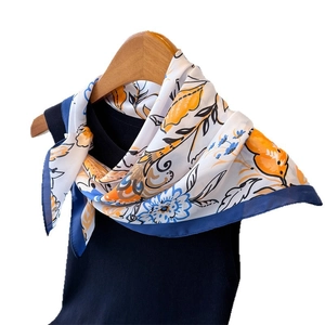 Floral print satin silk scarf with orange and blue patterns on white background