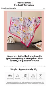Detailed view of square silk scarf with bow print and premium satin texture