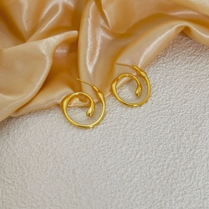 Polished 18K gold plated geometric drop earrings on elegant satin and stone display