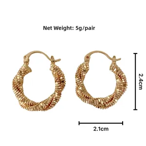 Detailed view of gold twisted metal hoop earrings showing size 2.4cm with 5g weight info