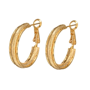 Minimalist matte gold C-shaped hoop earrings with polished edges on white background