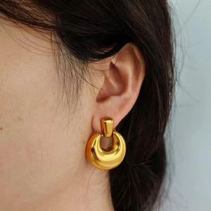 Retro geometric gold circular drop earrings with minimalist polished metal finish