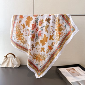 Detail of silk square scarf featuring vintage butterfly print and insect patterns