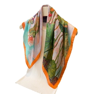 Artistic silk square scarf featuring hand-painted lotus pattern and orange hem