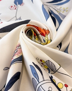 Macro detail of silk scarf featuring elegant floral prints and smooth draped texture