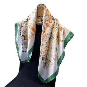 Floral print satin silk scarf for women featuring birds and orange green border accents
