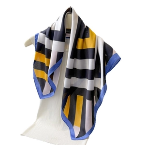 Striped color-block silk-like square scarf with yellow, black and white geometric patterns