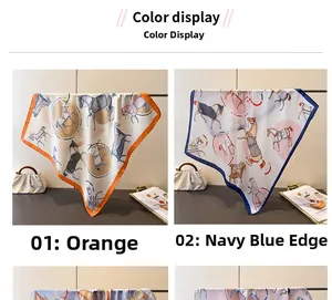 Detail view of silk scarf featuring equestrian horse prints in orange and navy blue