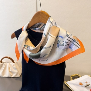 Detailed equestrian horse print silk square scarf with signature orange border and elegant silk texture