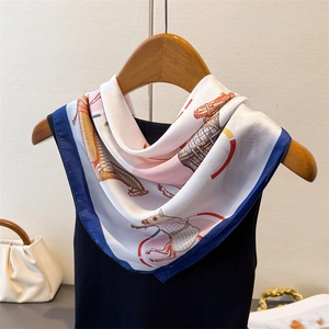 Elegant silk scarf with horse equestrian print on wooden hanger with luxury accessories