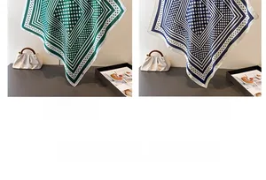 Detailed view of geometric polka dot silk-like scarf in green and navy blue options