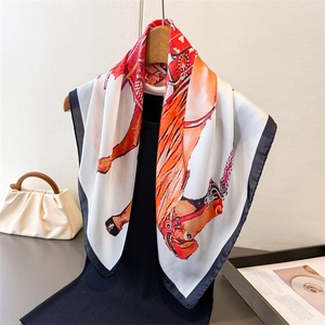 Silk-like equestrian square scarf featuring horse prints and bold orange borders