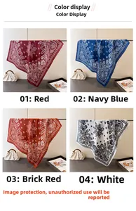 Detail view of four paisley silk scarves in red, navy blue, brick red, and white